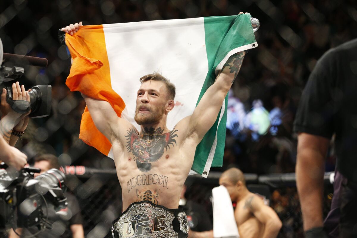 When did Conor McGregor become an undisputed UFC champion?